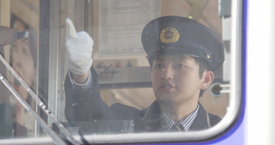 Picture of Mr. Matsumoto who is operating a train